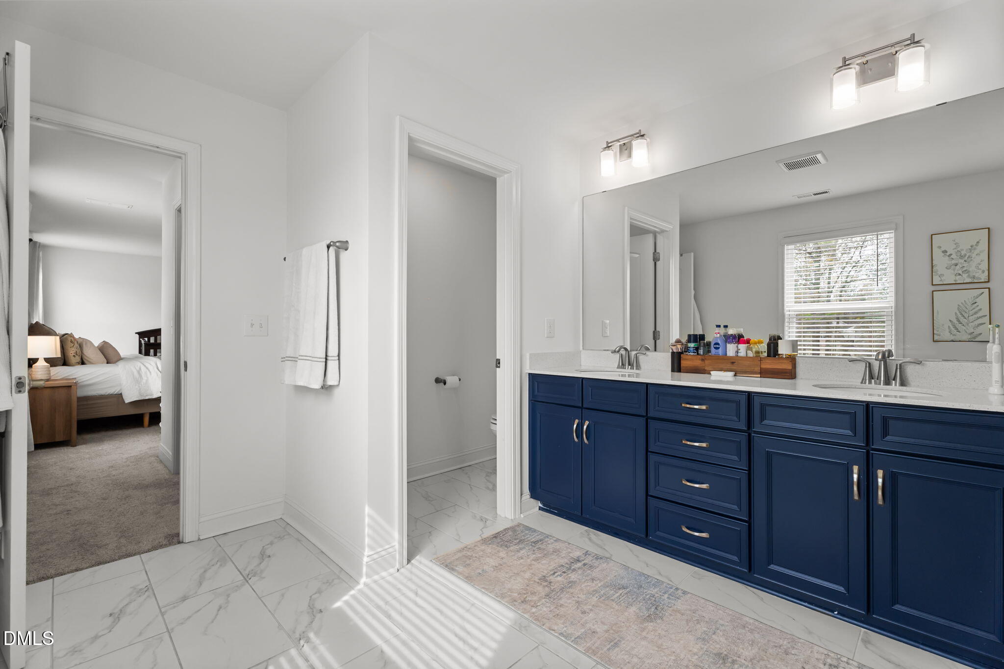145 Shadowdale Lane Rolesville, NC 27571 - Photo 23 of 43 a spacious bathroom with a granite countertop sink and a mirror