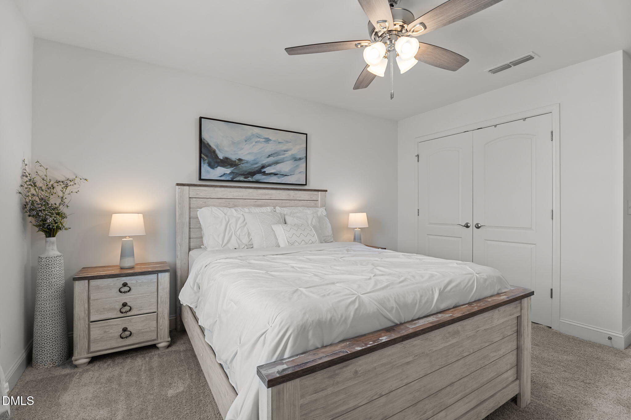 145 Shadowdale Lane Rolesville, NC 27571 - Photo 24 of 43 a bedroom with a bed and a chandelier