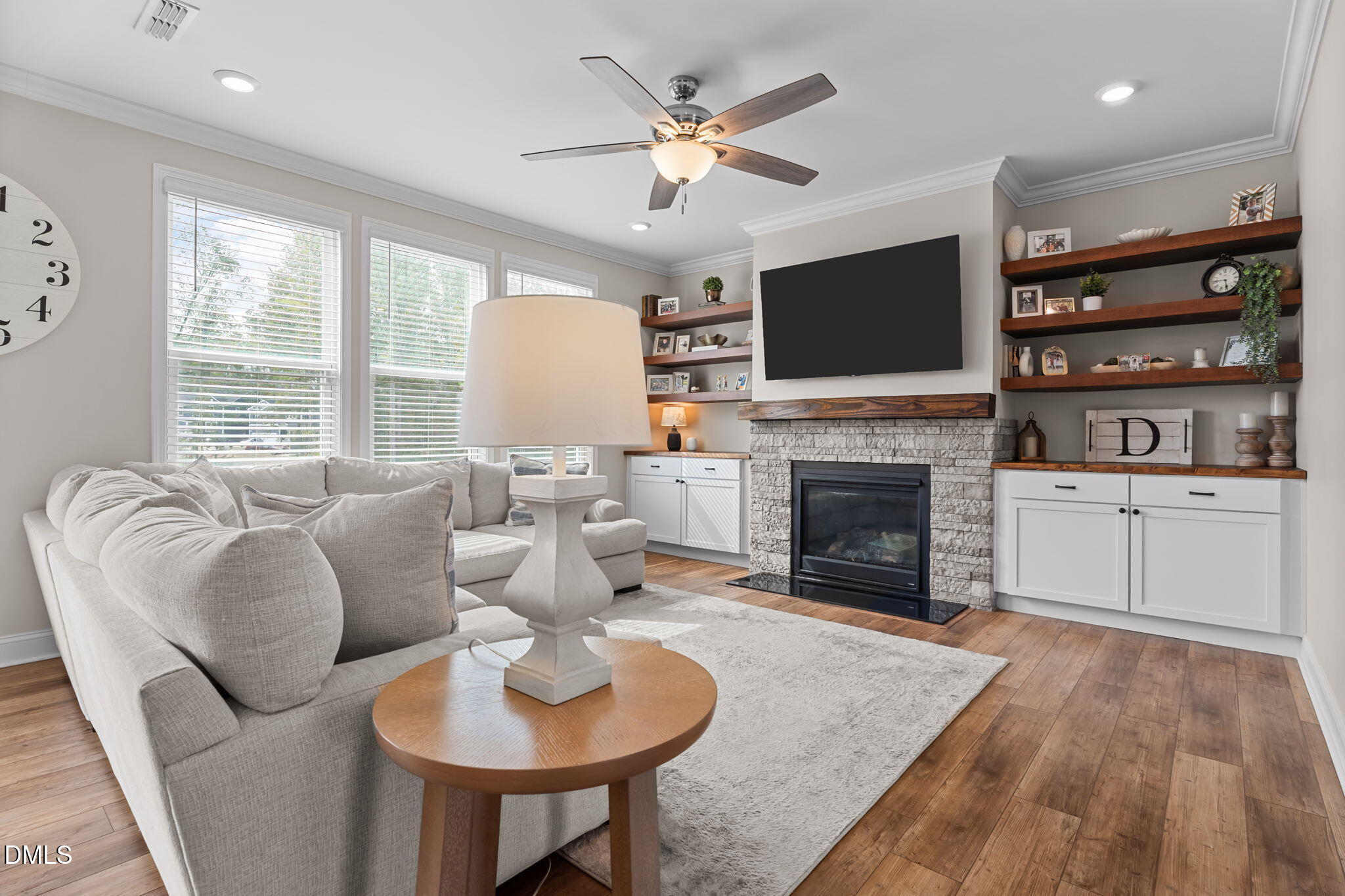 145 Shadowdale Lane Rolesville, NC 27571 - Photo 3 of 43 a living room with furniture a flat screen tv and a fireplace