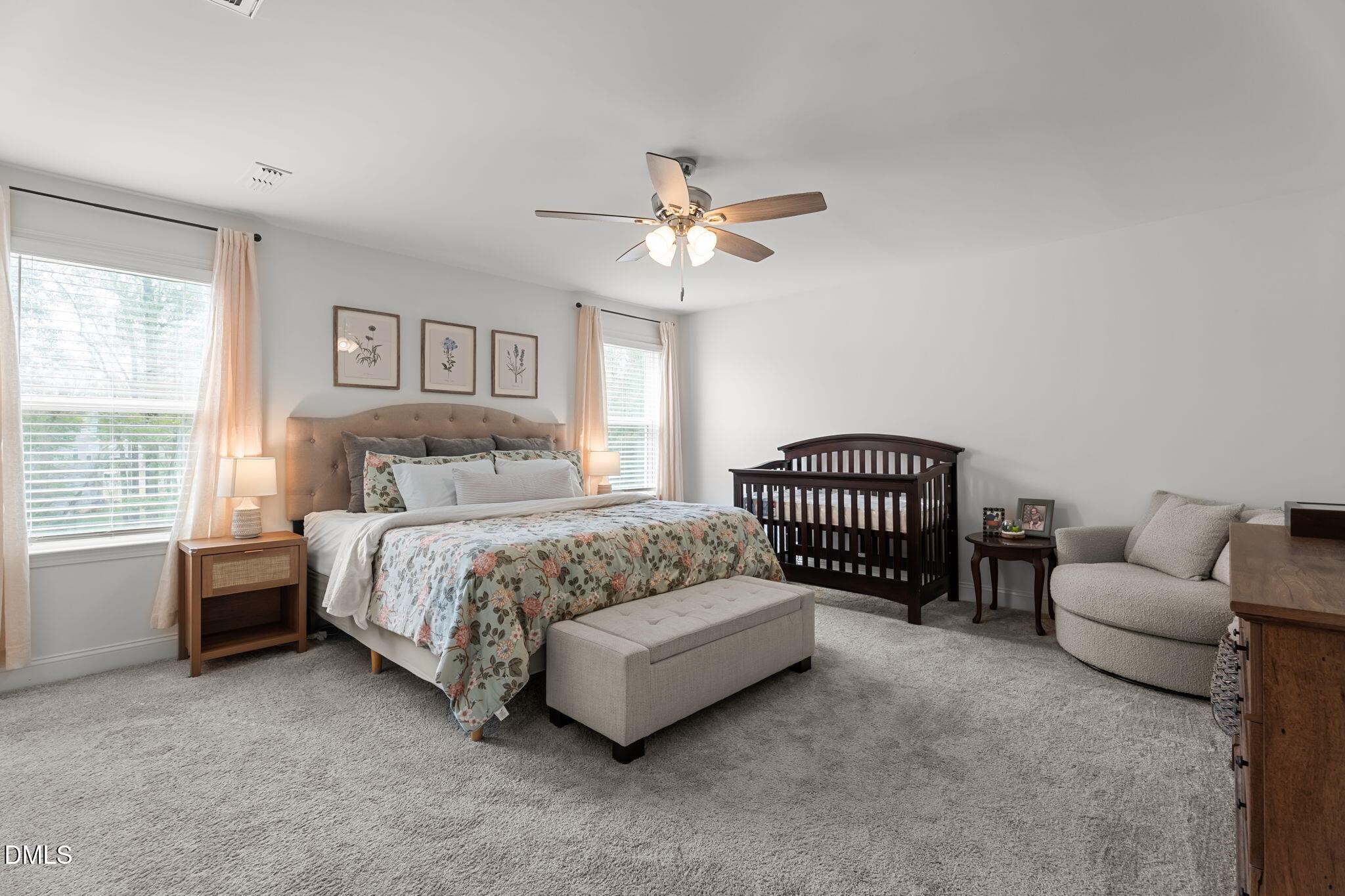 145 Shadowdale Lane Rolesville, NC 27571 - Photo 5 of 43 a spacious bedroom with a bed and a couch