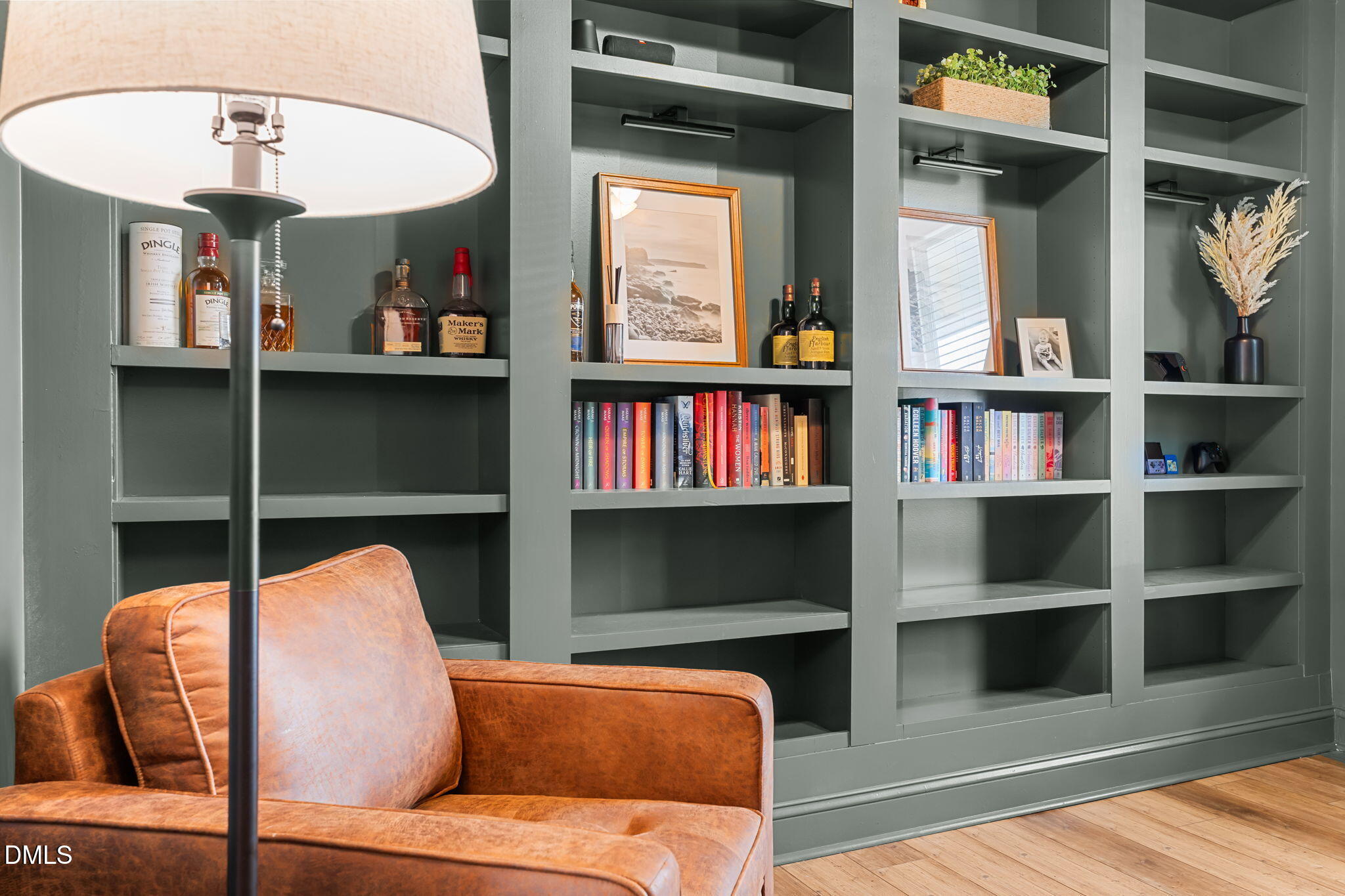 145 Shadowdale Lane Rolesville, NC 27571 - Photo 10 of 43 a living room with furniture and a book shelf