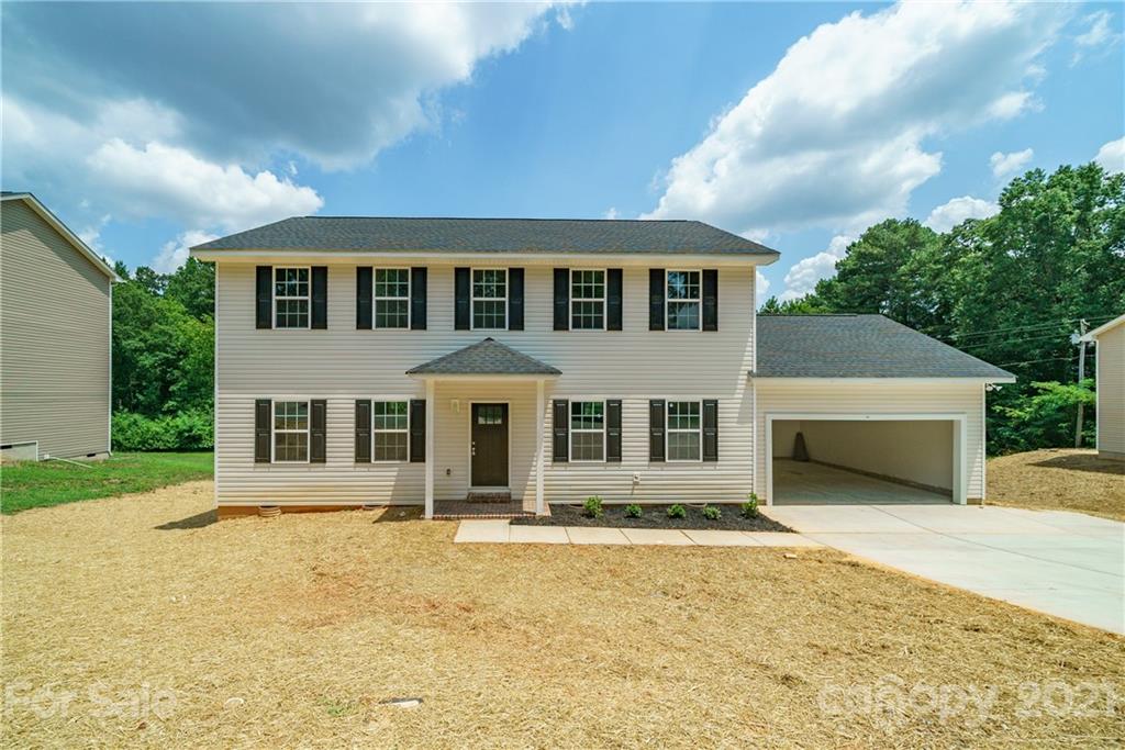 1802 Love Road Monroe, NC 28110 - Photo 1 of 48 a front view of a house with garden