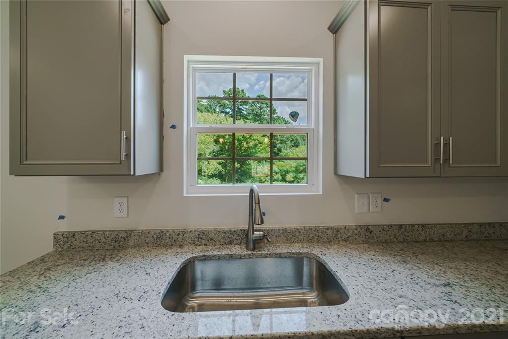 1802 Love Road Monroe, NC 28110 - Photo 11 of 48 a close view of sink and tap