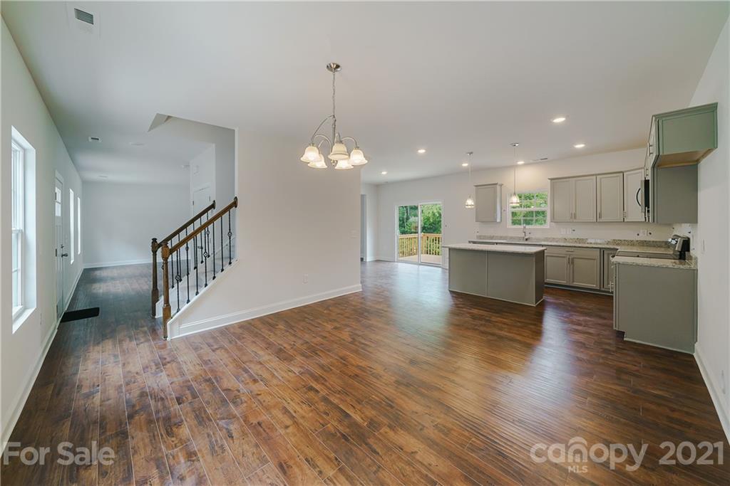 1802 Love Road Monroe, NC 28110 - Photo 23 of 48 a view of a kitchen with a sink and wooden floor