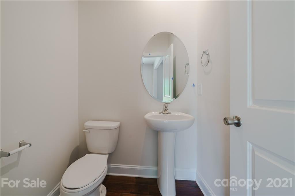 1802 Love Road Monroe, NC 28110 - Photo 24 of 48 a bathroom with a toilet sink and mirror