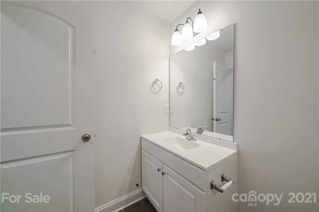 1802 Love Road Monroe, NC 28110 - Photo 34 of 48 a bathroom with a sink vanity and a mirror