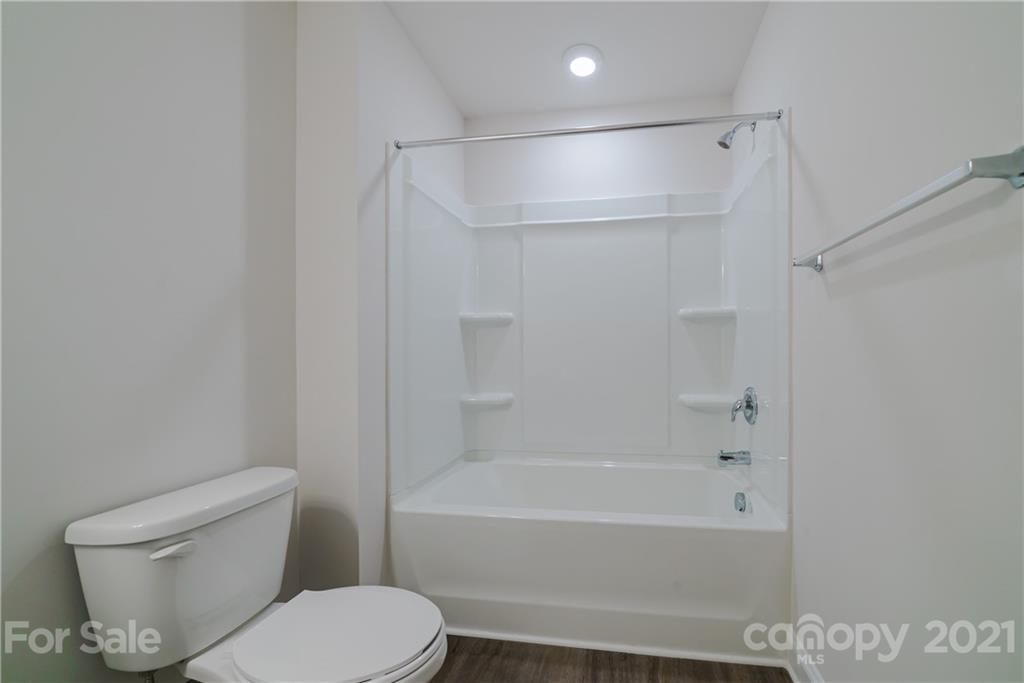 1802 Love Road Monroe, NC 28110 - Photo 36 of 48 a bathroom with a toilet and a bathtub