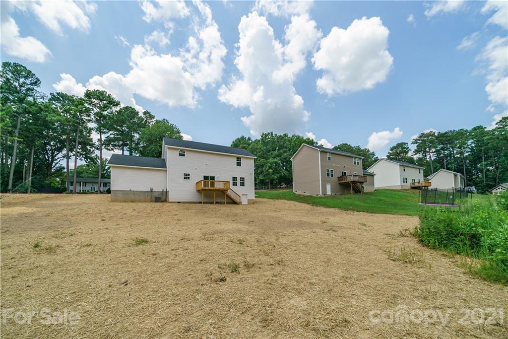 1802 Love Road Monroe, NC 28110 - Photo 41 of 48 a big house with a big yard and large trees