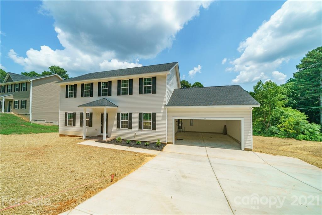 1802 Love Road Monroe, NC 28110 - Photo 43 of 48 a front view of a house with a yard