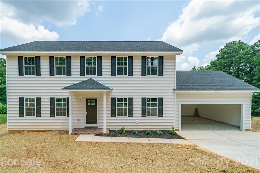 1802 Love Road Monroe, NC 28110 - Photo 44 of 48 front view of a house with a yard