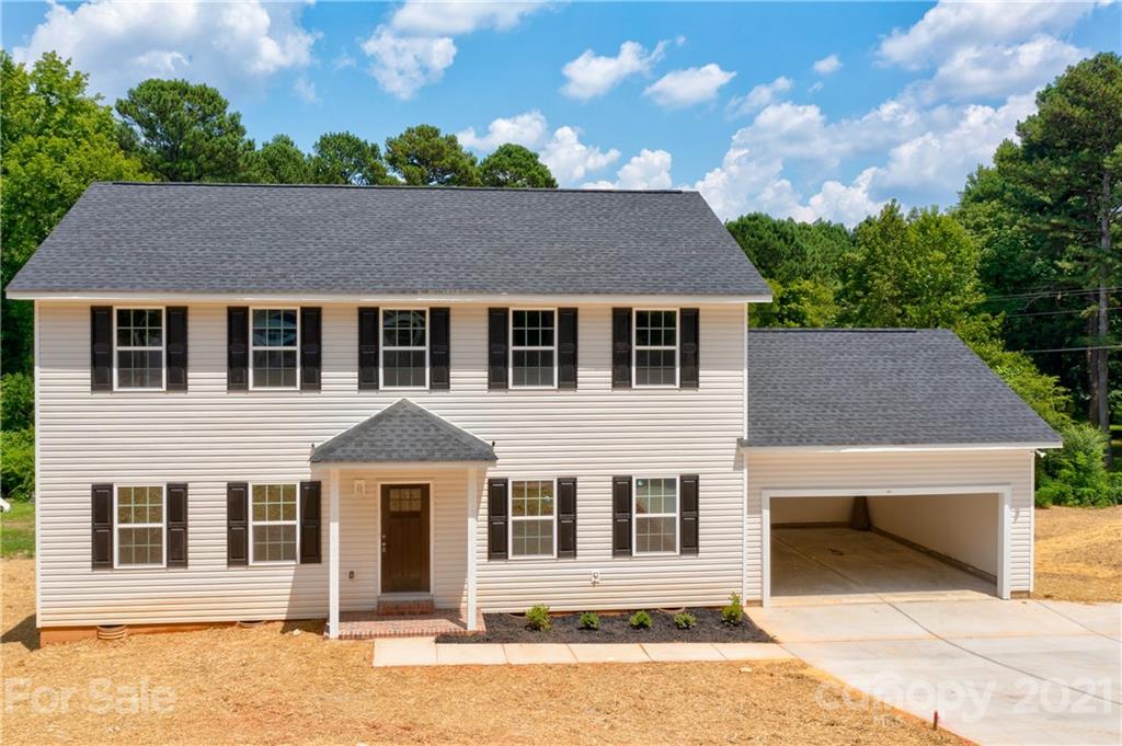 1802 Love Road Monroe, NC 28110 - Photo 45 of 48 a house view with a garden space