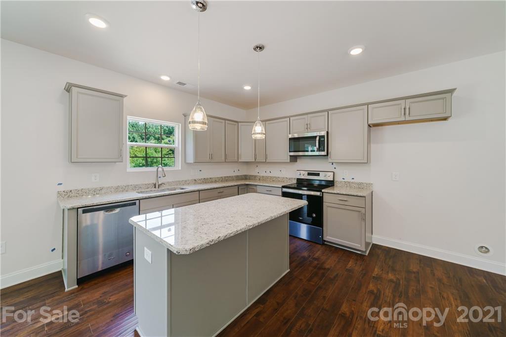 1802 Love Road Monroe, NC 28110 - Photo 8 of 48 a kitchen with a sink stove top oven and refrigerator