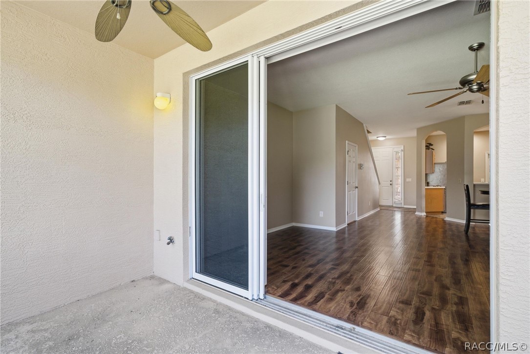 1598 West Spring Meadow Loop Lecanto, FL 34461 - Photo 27 of 74 Covered Screened Porch From Indoor Open Living & Dining