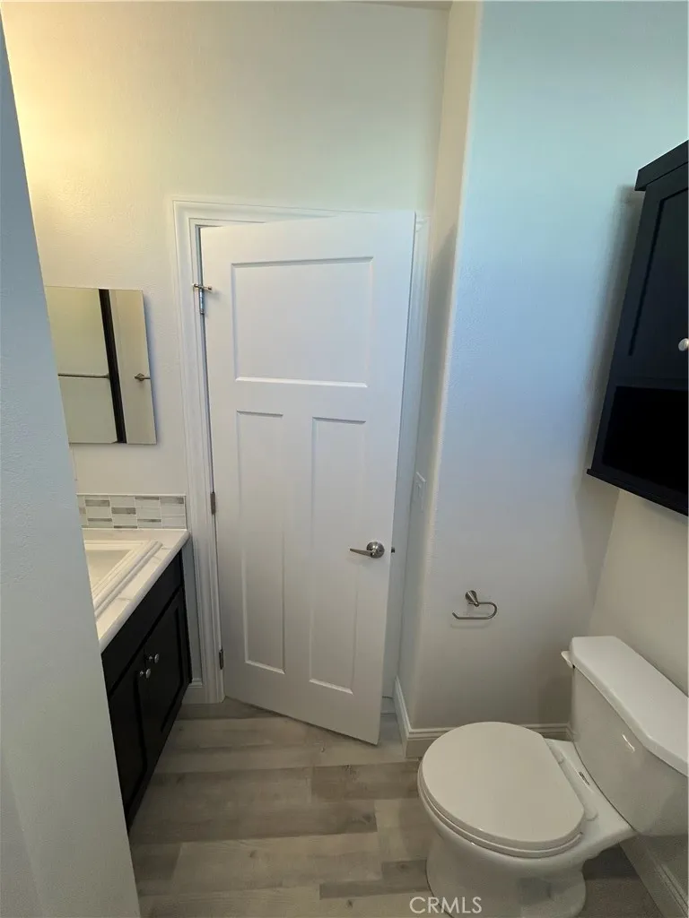 600 Gladstone, Unit 45 Azusa, CA 91702 - Photo 11 of 16 a bathroom with a toilet a sink and a mirror
