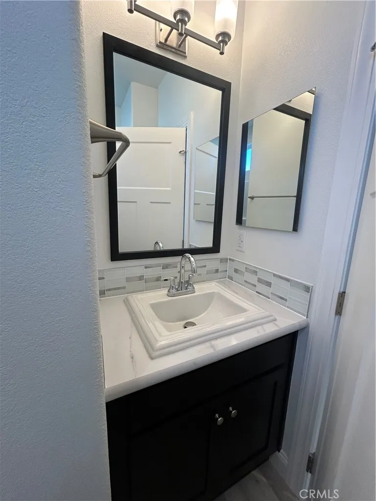600 Gladstone, Unit 45 Azusa, CA 91702 - Photo 12 of 16 a bathroom with a sink and a mirror