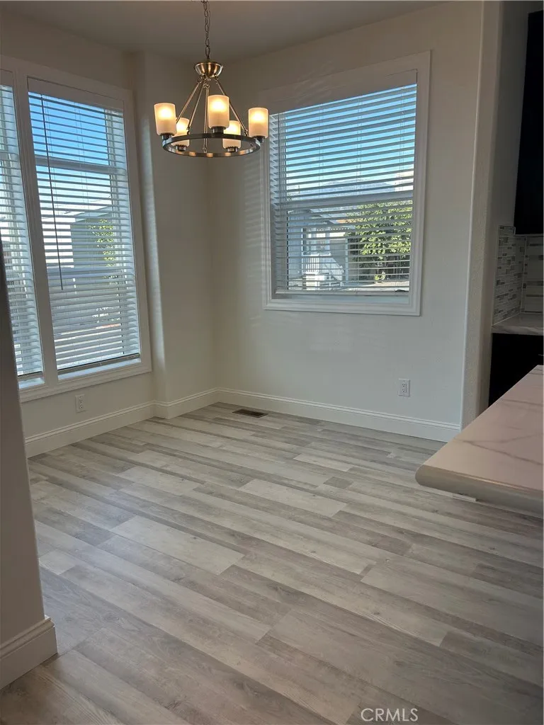600 Gladstone, Unit 45 Azusa, CA 91702 - Photo 2 of 16 a view of wooden floor cabinets and window in an empty room