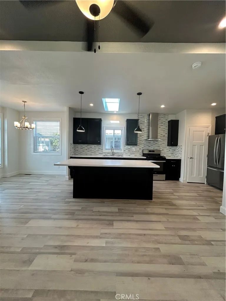 600 Gladstone, Unit 45 Azusa, CA 91702 - Photo 4 of 16 a large kitchen with a sink stainless steel appliances and cabinets