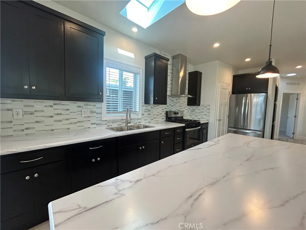 600 Gladstone, Unit 45 Azusa, CA 91702 - Photo 6 of 16 a spacious bathroom with a double vanity sink and a mirror