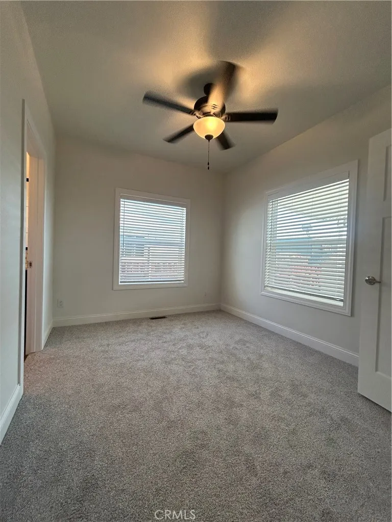 600 Gladstone, Unit 45 Azusa, CA 91702 - Photo 8 of 16 en empty room with windows and fan