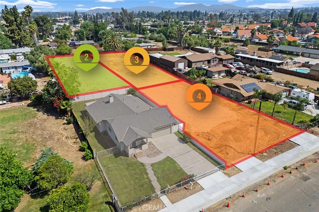 an aerial view of a house with a swimming pool