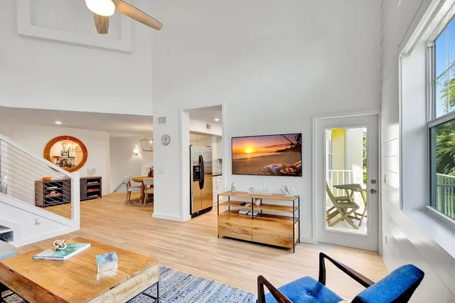 a view of a livingroom with furniture and staircase