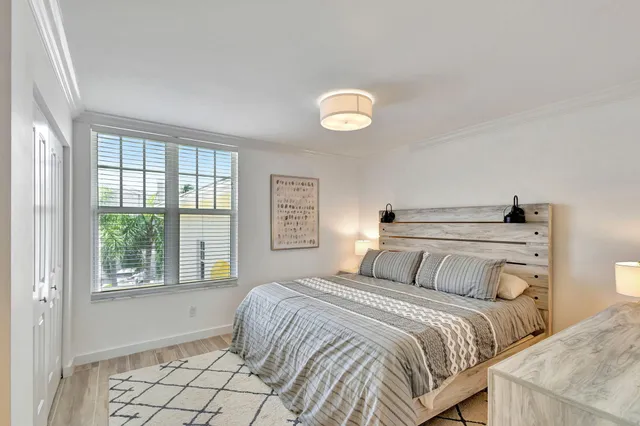 a bathroom with a granite countertop sink a mirror and a shower