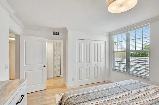 a view of a balcony with table and chairs