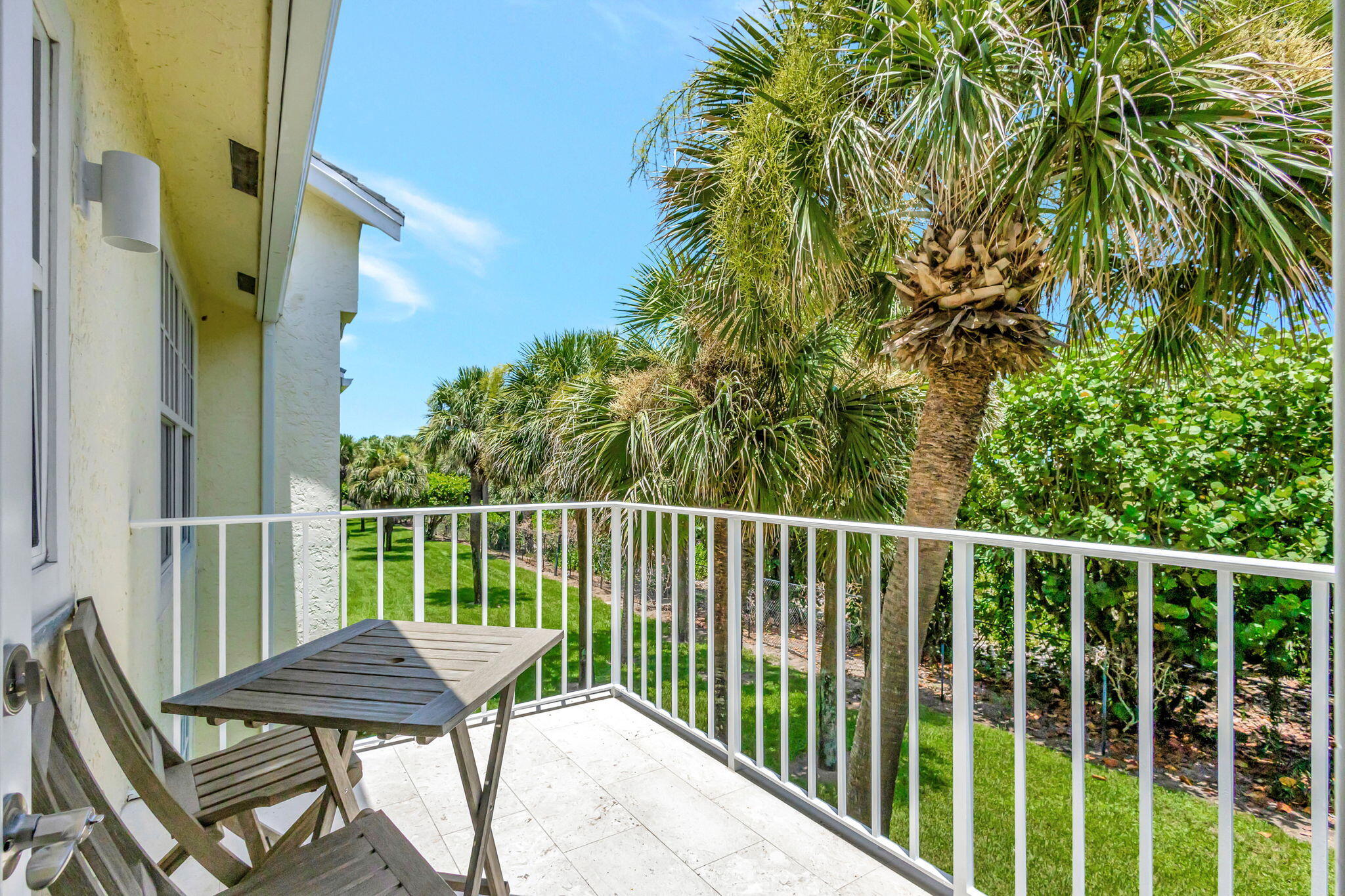 105 Mainsail Circle Jupiter, FL 33477 - Photo 31 of 85 a view of a balcony with table and chairs