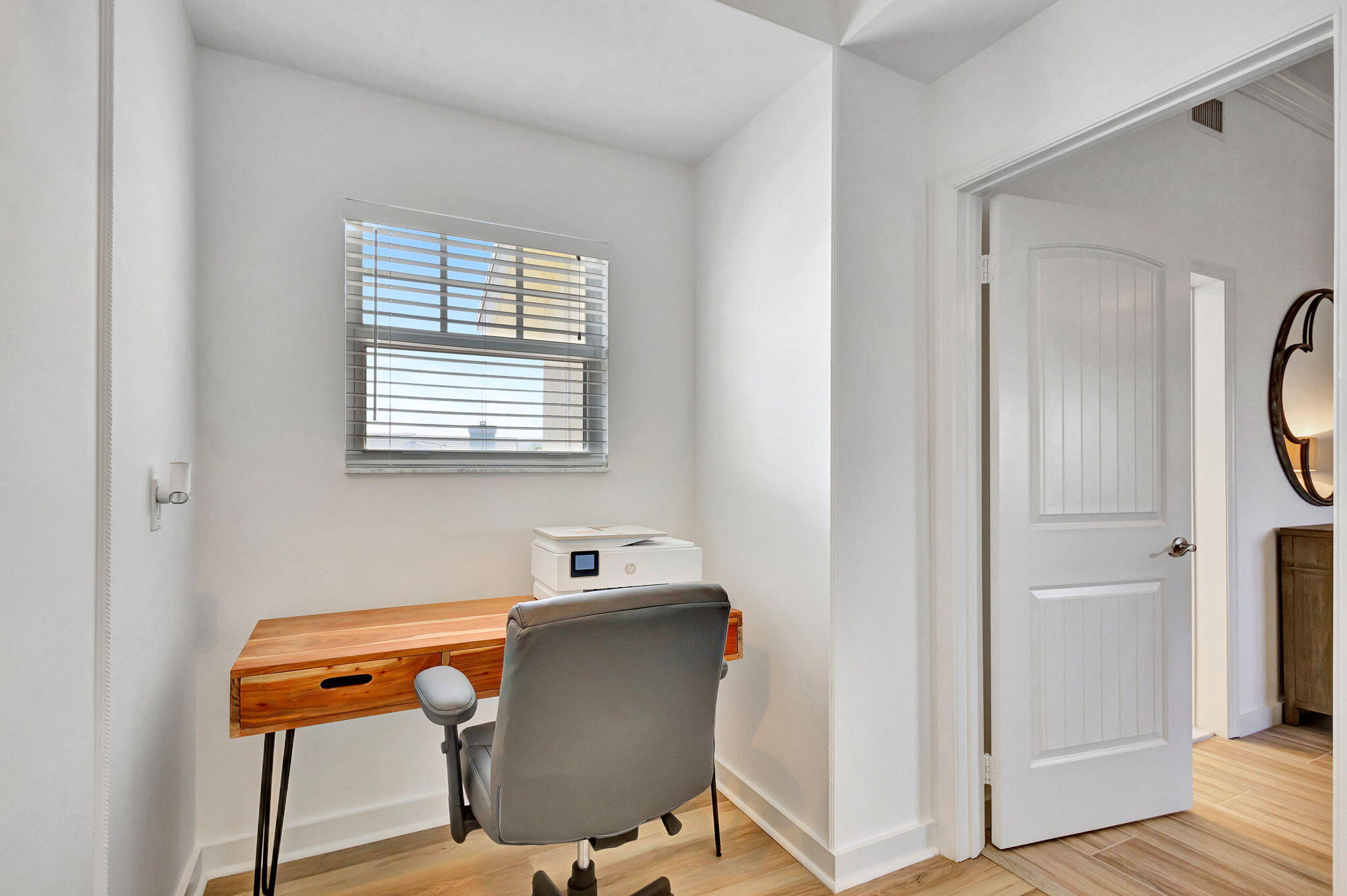 105 Mainsail Circle Jupiter, FL 33477 - Photo 35 of 85 a room with chair and wooden floor