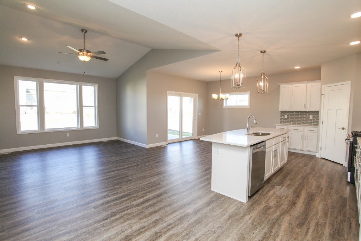 2935 Glendale Lane Normal, IL 61761 - Photo 2 of 29 a large kitchen with hard wood floors stainless steel appliances a window and a fireplace