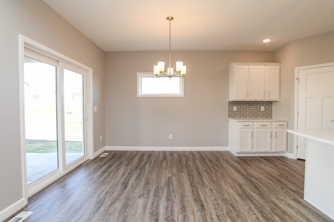 2935 Glendale Lane Normal, IL 61761 - Photo 12 of 29 a view of a kitchen with wooden floor and a window