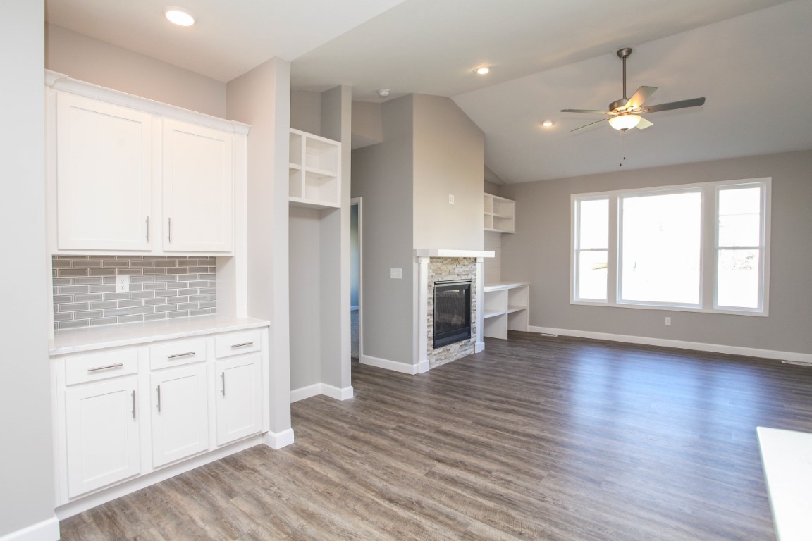 2935 Glendale Lane Normal, IL 61761 - Photo 13 of 29 an empty room with wooden floor cabinet and windows