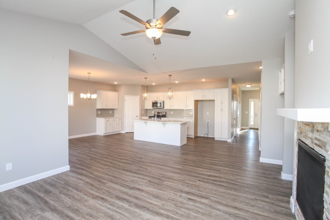 2935 Glendale Lane Normal, IL 61761 - Photo 15 of 29 a view of an empty room and kitchen with furniture a ceiling fan
