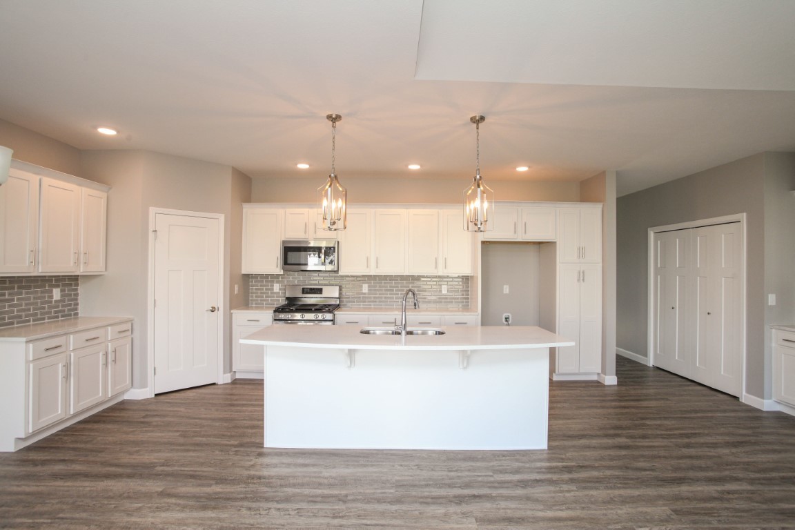 2935 Glendale Lane Normal, IL 61761 - Photo 3 of 29 a large kitchen with stainless steel appliances kitchen island a large counter top and a wooden floors