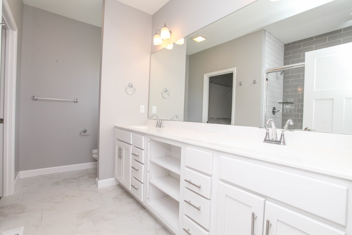 2935 Glendale Lane Normal, IL 61761 - Photo 22 of 29 a bathroom with a sink double vanity and a mirror