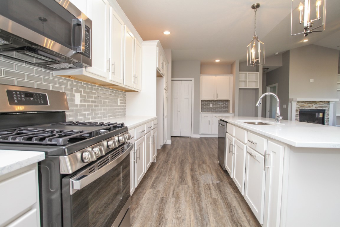 2935 Glendale Lane Normal, IL 61761 - Photo 7 of 29 a kitchen with stainless steel appliances a sink stove and cabinets