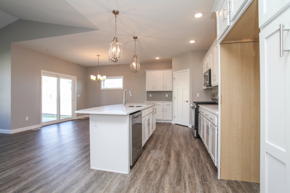 2935 Glendale Lane Normal, IL 61761 - Photo 8 of 29 a large kitchen with granite countertop a large counter top a sink stainless steel appliances and cabinets