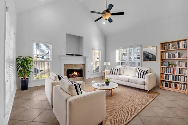 a living room with furniture and a fireplace