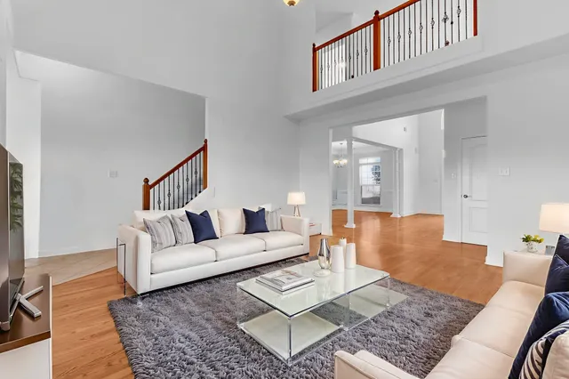 a living room with furniture and a rug