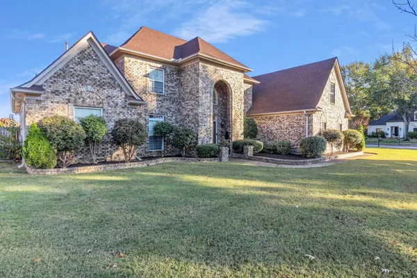 a view of a house with a big yard