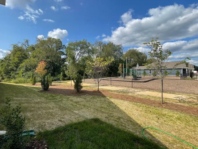a view of a backyard of the house