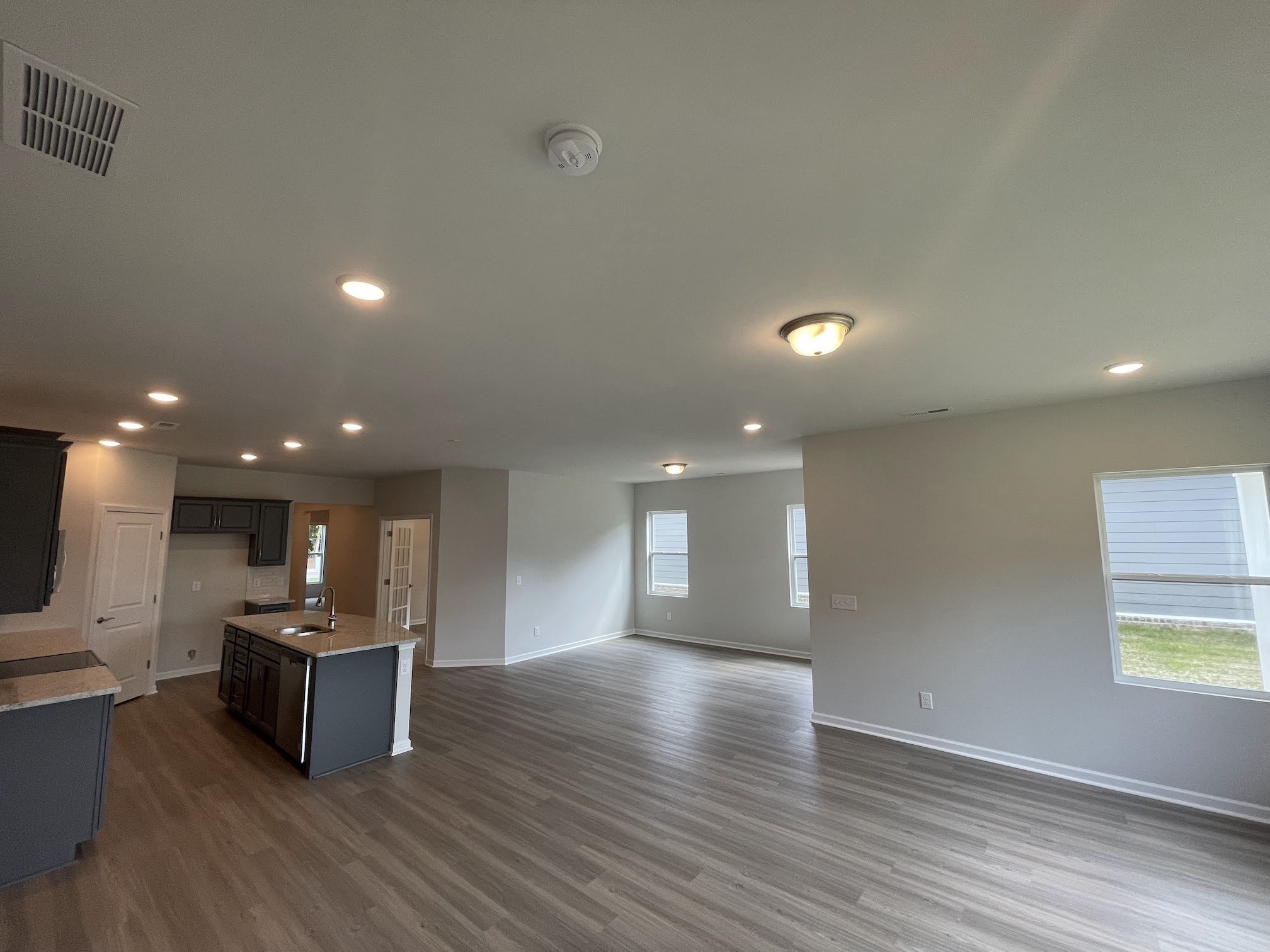 2922 Campanella Drive Murfreesboro, TN 37128 - Photo 5 of 21 a view of kitchen with kitchen island microwave and wooden floor