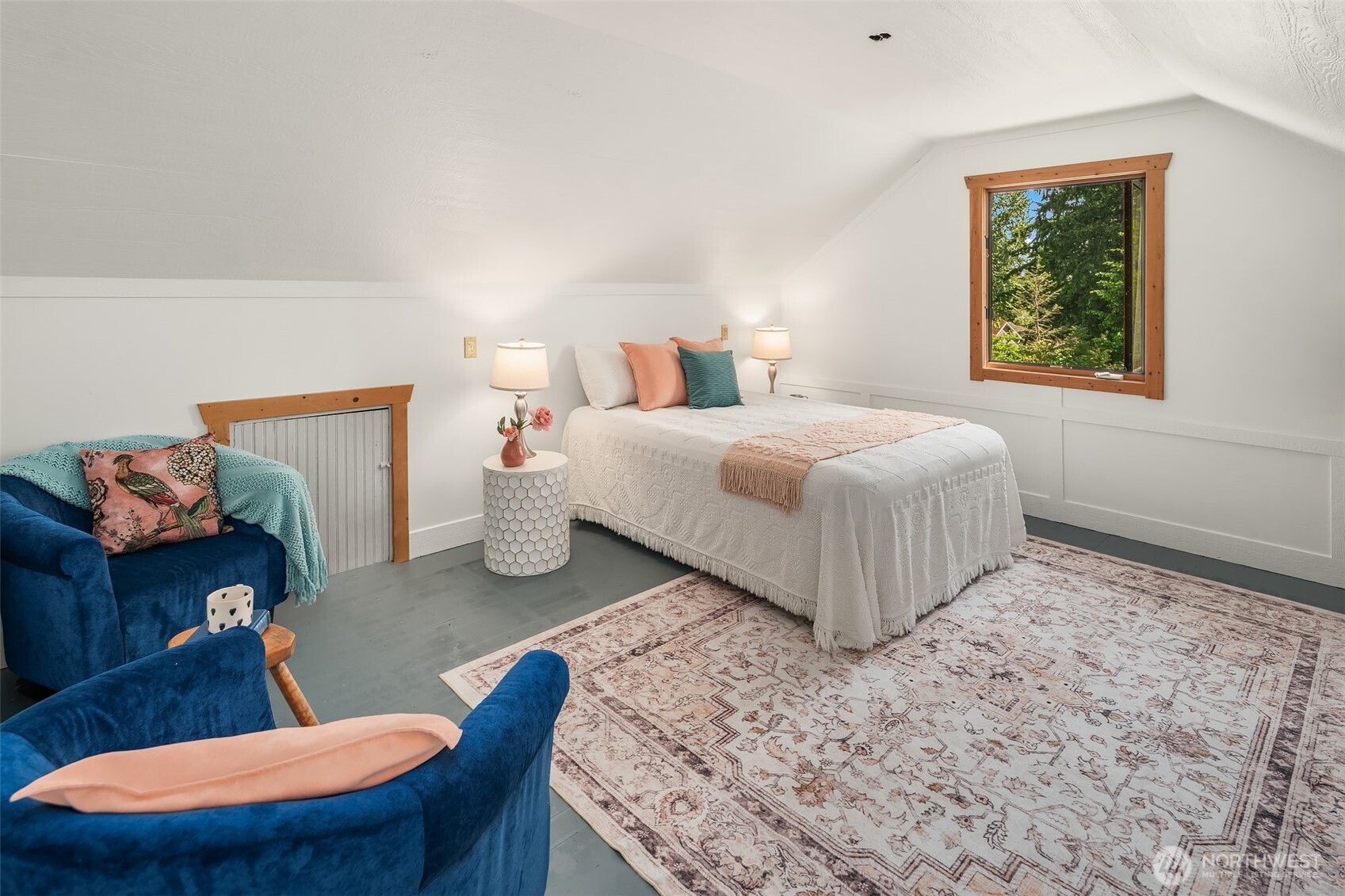 19416 Beall Road Southwest Vashon, WA 98070 - Photo 22 of 40 a bedroom with a bed and a dresser
