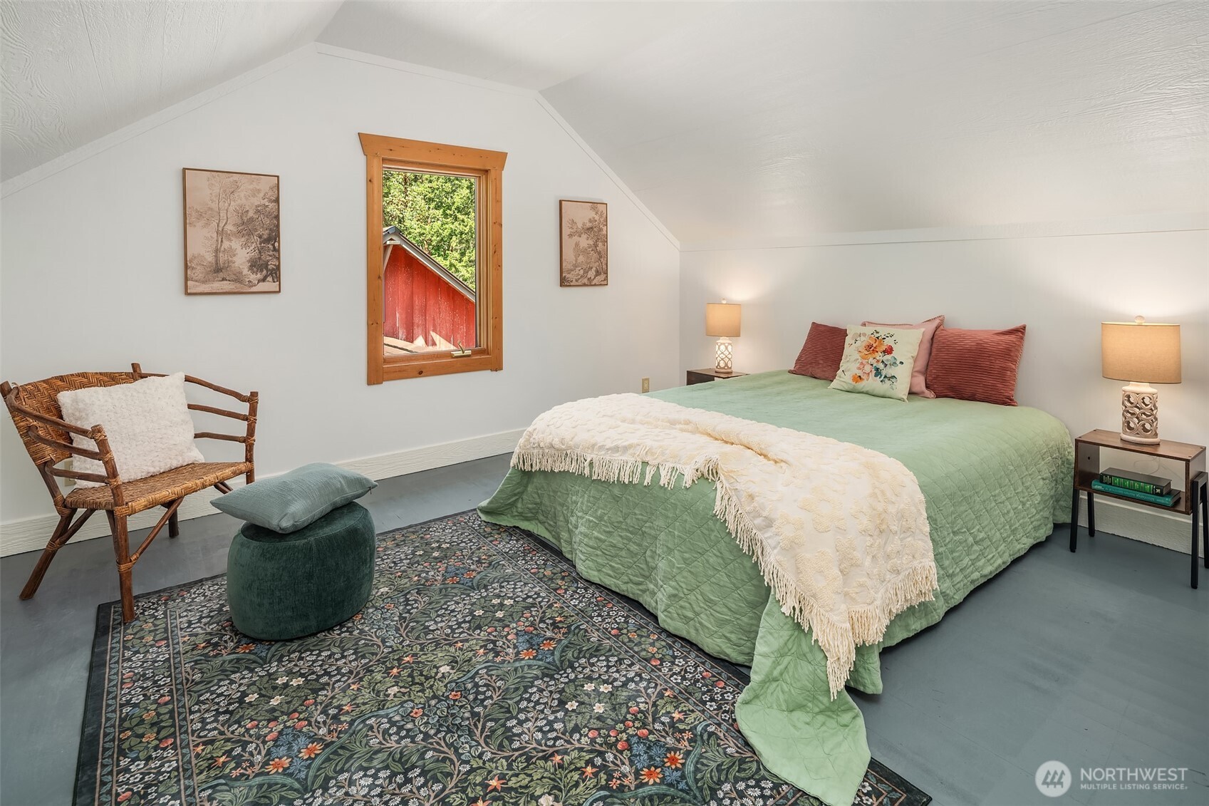 19416 Beall Road Southwest Vashon, WA 98070 - Photo 24 of 40 a bedroom with a bed and a chair