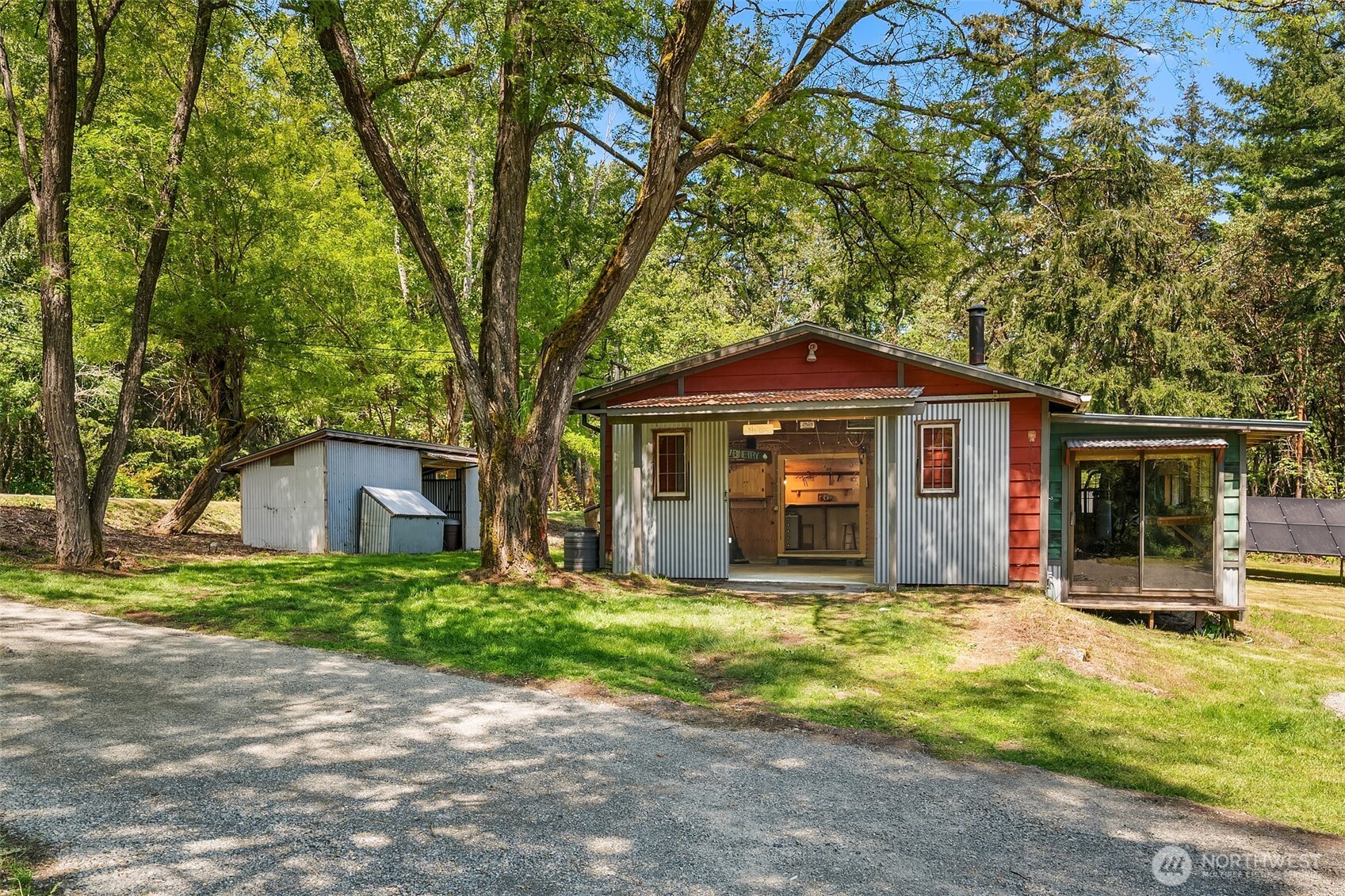 19416 Beall Road Southwest Vashon, WA 98070 - Photo 25 of 40 a view of a house with a yard