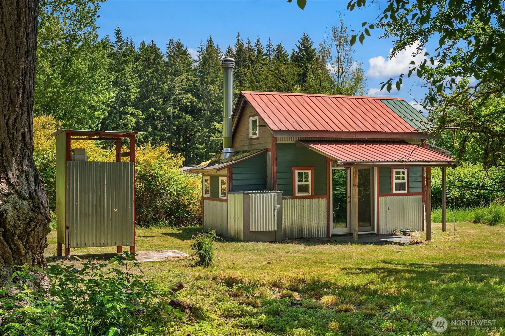 19416 Beall Road Southwest Vashon, WA 98070 - Photo 32 of 40 a backyard of a house with yard and outdoor seating