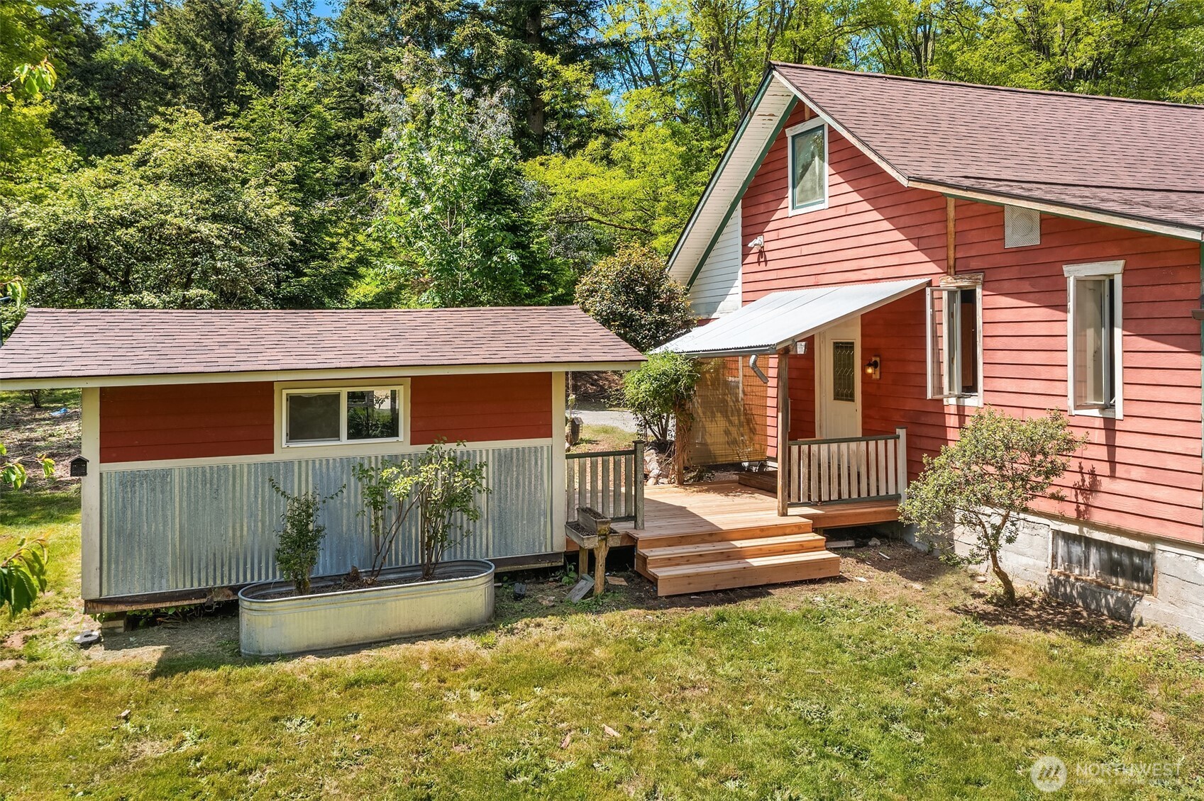 19416 Beall Road Southwest Vashon, WA 98070 - Photo 38 of 40 a view of a house with a bed and a yard