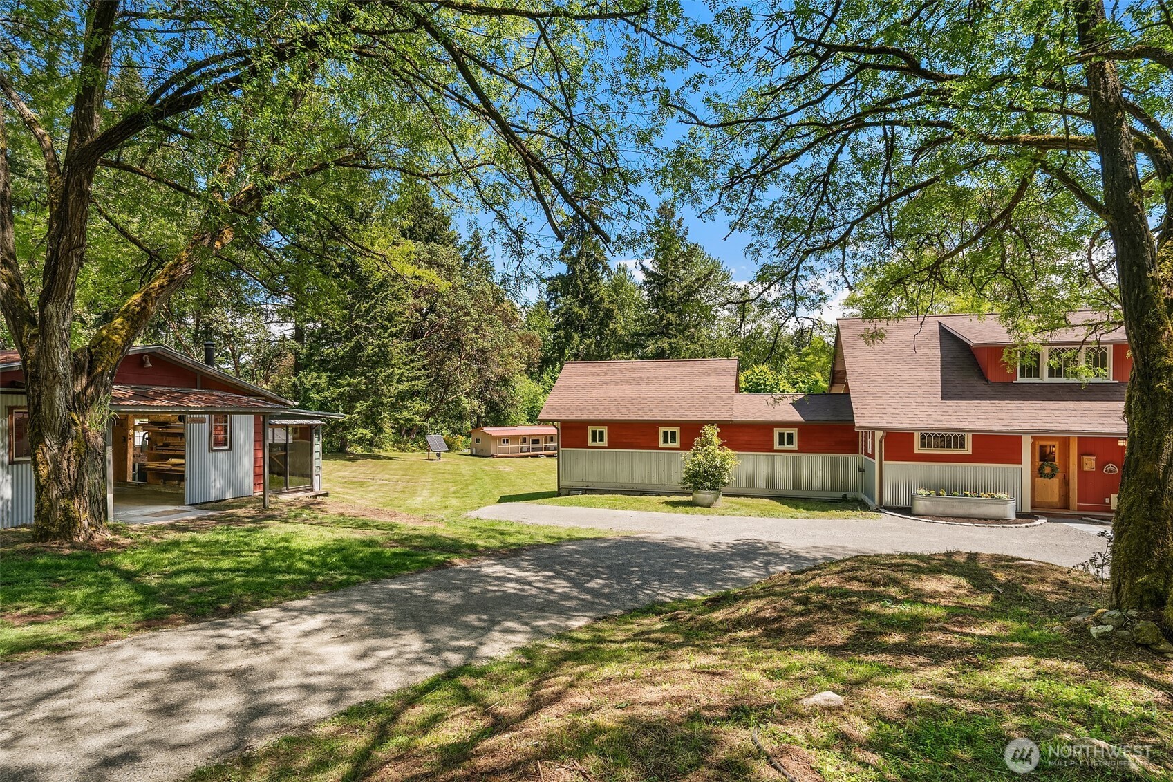 19416 Beall Road Southwest Vashon, WA 98070 - Photo 40 of 40 a front view of a house with a garden