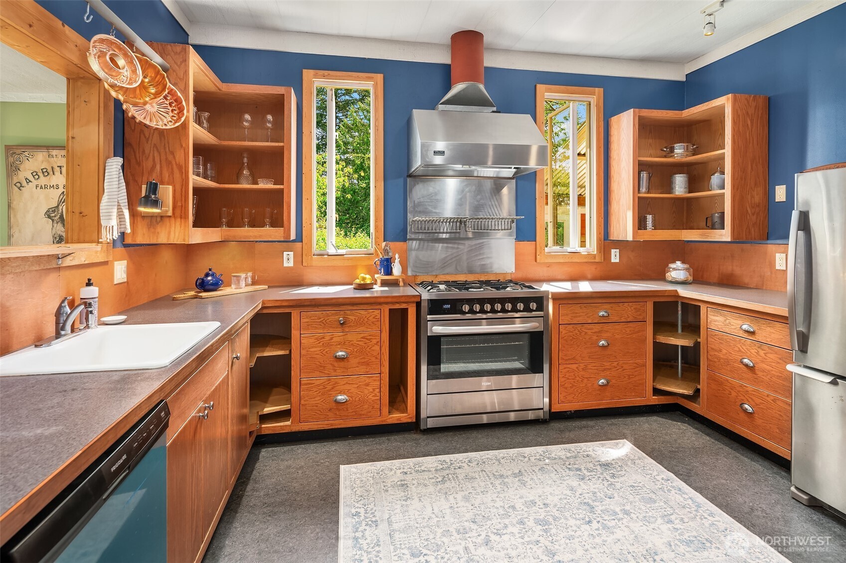 19416 Beall Road Southwest Vashon, WA 98070 - Photo 8 of 40 a kitchen with stainless steel appliances a stove and a sink