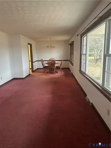 a view of livingroom with hardwood floor and a flat screen tv